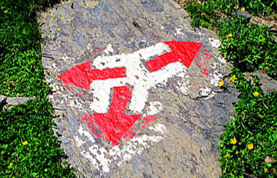 Swiss-hiking-arrows-on-a-rock-redirect
